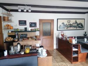 a kitchen with a counter and a table with food at Haus Schwarzwaldblick in Hornberg