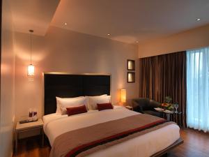 Spree Shivai Hotel Pune客房内的一张或多张床位