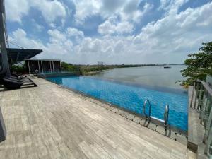 a swimming pool with a view of a river at Peaceful Sea view Cozy APT at Batam Center - By MESA in Batam Center