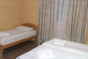 Letto o letti in una camera di guest house kesa