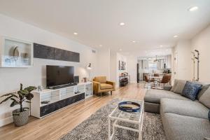 a living room with a couch and a tv at 6224 S Datura St in Littleton