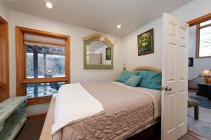 a bedroom with a bed and a window at CR 213 - 2 Bedroom in Durango