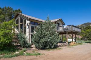 a house with a porch and a deck on a house at CR 213 - 2 Bedroom in Durango