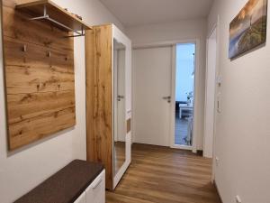 a hallway with a sliding barn door in a house at Ferienwohnung Angela - a90191 in Walchum