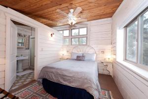 a bedroom with a bed and a ceiling fan at CR 213 - 3 Bedroom in Durango