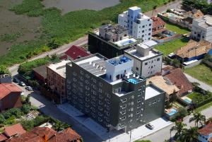 an overhead view of a building in a city at Hotel Du Lac Macaé in Macaé