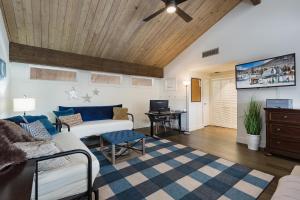 a living room with a couch and a tv at Tamarron Gambel Oak - 768 and 769 - Combo in Durango