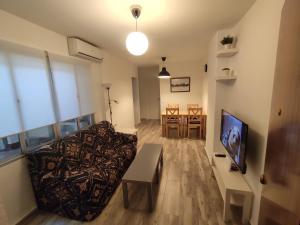 TV a/nebo společenská místnost v ubytování Centre Sweet Home