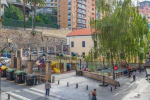 a park with a playground in a city at Plaza Unamuno - Casco Viejo - PARKING opcional in Bilbao