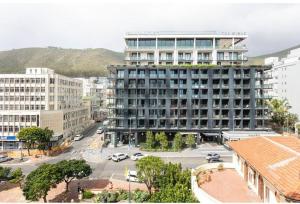 a large building in a city with a street at Sweet Flamingo in Cape Town