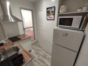 Kuchyň nebo kuchyňský kout v ubytování Centre Sweet Home