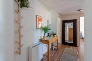 a room with a desk with a plant on a wall at GuestReady - Modern stay by Pheonix Park in Dublin