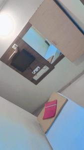 an overhead view of a room with a chair and a mirror at Hotel Gitanjali in Ahmedabad