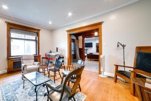 a living room with chairs and a piano at Spacious Pittsburgh Rental Walk to Frick Park! in Pittsburgh