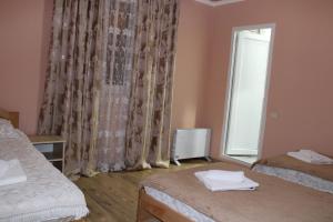 Letto o letti in una camera di guest house kesa