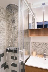 a bathroom with a shower and a sink at Sublime 3 Rooms Showers in Colombes