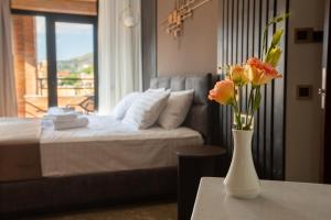 Postel nebo postele na pokoji v ubytování Bellevue Boutique Hotel