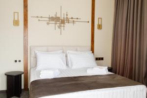 Postel nebo postele na pokoji v ubytování Bellevue Boutique Hotel