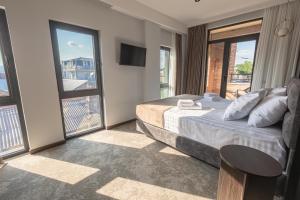 Postel nebo postele na pokoji v ubytování Bellevue Boutique Hotel