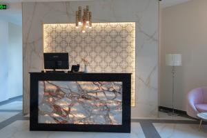 TV a/nebo společenská místnost v ubytování Bellevue Boutique Hotel