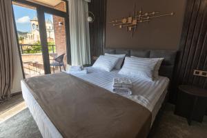 Postel nebo postele na pokoji v ubytování Bellevue Boutique Hotel
