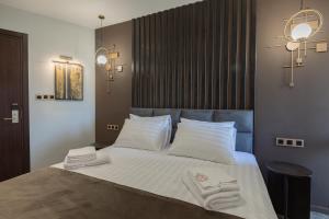 Postel nebo postele na pokoji v ubytování Bellevue Boutique Hotel