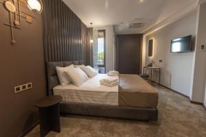 Postel nebo postele na pokoji v ubytování Bellevue Boutique Hotel