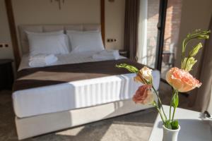 Postel nebo postele na pokoji v ubytování Bellevue Boutique Hotel