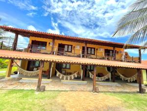 a view of a resort building with a balcony at Pousada Portal do Maragogi in Maragogi