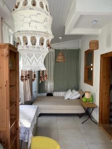 a bedroom with a large chandelier in a room at Beach Villas in Kemer