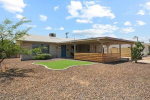 a house with a golf course in front of it at Home 8 Minutes to Old Town Scottsdale in Scottsdale