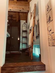 a hallway of a home with a stairway with a room with atainedterness at Sottotetto grazioso St.Moritz in St. Moritz