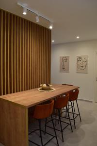 a conference room with a wooden table and chairs at Downtown Delight in Chania Town