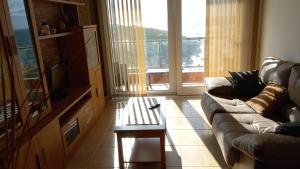 a living room with a couch and a coffee table at Beiramar in Muxia