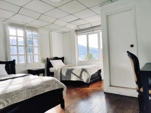 Postel nebo postele na pokoji v ubytování Hotel Muros Quito
