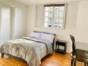Postel nebo postele na pokoji v ubytování Hotel Muros Quito