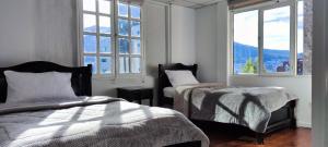 Postel nebo postele na pokoji v ubytování Hotel Muros Quito