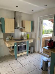 a kitchen with a sink and a stove in it at Haus und Garten nur für Dich in Duderstadt