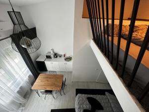 a small room with a table and a bed at Vila Ana Boutique Hotel in Cluj-Napoca +43 photos