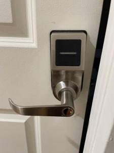 a metal door handle on a white door at 1D CLOSe in New York