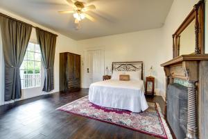 a bedroom with a bed and a fireplace at Evangeline in Grand pré