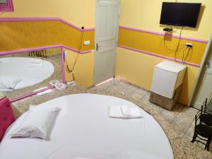 Postel nebo postele na pokoji v ubytování Hotel Paraíso