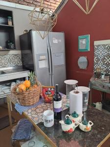 a kitchen with a counter top with a refrigerator at Hotel La Casa Ovalle in San Vicente de Chucurí