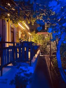 a garden at night with lights on a house at Eco in Yerevan