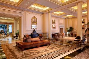 a large lobby with a couch in the middle of a room at Hotel Grande Bretagne, a Luxury Collection Hotel, Athens in Athens
