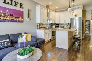 a kitchen and living room with a couch and a table at Cozy Philadelphia Rental Steps to Subway Station! in Philadelphia