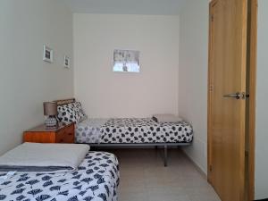Ένα ή περισσότερα κρεβάτια σε δωμάτιο στο Apartamento Taray