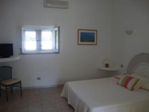 Un pat sau paturi într-o cameră la Camping Residence Chalet La Pomposa Terrazzoni