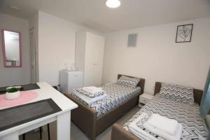 Letto o letti in una camera di Olymp Apartmani