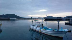 a boat sitting in the water at a dock at Minpaku Togenkyo 2 - Vacation STAY 15096 in Toba